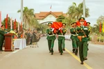 The remains of 12 Vietnamese volunteer soldiers and experts, who laid down their lives in different periods in Laos’ Savannakhet province, are repatriated following a handover ceremony at the Lao Bao (Vietnam's Quang Tri province) - Densavan (Savannakhet) international border gate on May 21. (Photo: VNA)