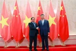 Vietnamese Prime Minister Pham Minh Chinh (L) and General Secretary of the Communist Party of China (CPC) Central Committee and President of China Xi Jinping at their meeting on August 31. (Photo: VNA)