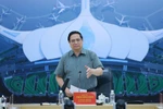 Prime Minister Pham Minh Chinh speaks at a working session with contractors and construction units of the Long Thanh International Airport project on December 14, 2025 (Photo; VNA)