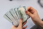 E-transfers from 1,000 USD at Vietnam’s IFC must be reported, according to the SBV's draft decree. (Photo: VNA)