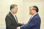 Party General Secretary To Lam (L) and former Party General Secretary Nong Duc Manh. (Photo: VNA)