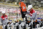 Workers assemble automotive components at Skoda's plant in Vietnam. (Photo: VNA)