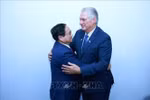 Vietnamese Prime Minister Pham Minh Chinh (L) meets with First Secretary of the Communist Party of Cuba Central Committee and President of Cuba Miguel Díaz Canel in Rio de Janeiro, Brazil, on July 6 (local time) on the sidelines of the expanded BRICS summit. (Photo: VNA)