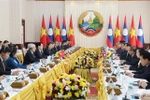 At the meeting between Vietnamese State President Luong Cuong and Lao Prime Minister Sonexay Siphandone in Vientiane on April 25. (Photo: VNA)