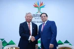 Vietnamese Prime Minister Pham Minh Chinh (right) and Jin Liqun, President and Chair of the Board of Directors of the Asian Infrastructure Investment Bank (AIIB) (Photo: VNA)