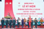Party General Secretary To Lam (fourth, right) presents the “Hero of the People’s Armed Forces” title to the Military Region 9 armed forces in recognition of its significant contributions to the revolutionary cause of the Party, State, and people. (Photo: VNA)