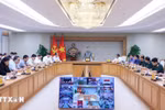 Deputy PM Tran Hong Ha speaks at the meeting. (Photo: VNA)