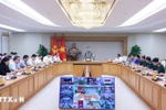 Deputy PM Tran Hong Ha speaks at the meeting. (Photo: VNA)