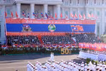 A military parade and march held to celebrate the 50th National Day of the Lao People’s Democratic Republic. (Photo: VNA)