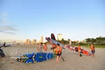 Tourists prepare to surf off the coast of Da Nang. (Photo: VNA)