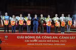 Prime Minister Pham Minh Chinh and Minister of Public Security General Luong Tam Quang present flowers and souvenir flags to heads of the football teams at the opening ceremony of the ASEAN Police Football Open 2025. (Photo: VNA)