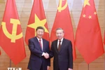 General Secretary of the Communist Party of Vietnam To Lam (R) and General Secretary of the Communist Party of China and President of China Xi Jinping (Photo: VNA)