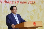 Prime Minister Pham Minh Chinh on October 9 chairs a nationwide teleconference to launch the National Target Programme on Drug Prevention and Control to 2030. (Photo: VNA)