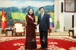 General Secretary of the Lao People’s Revolutionary Party (LPRP) and President of Laos Thongloun Sisoulith (R) receives Vietnamese State Vice President Vo Thi Anh Xuan on August 21. (Photo: VNA)