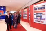 Deputy Prime Minister Bui Thanh Son and delegates visit the photo exhibition within the first Congress of the Government's Party Organisation on October 12. (Photo: VNA)