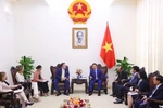 At a meeting between Deputy PM Tran Hong Ha, US Ambassador to Vietnam Marc Knapper and a delegation from the United States Agency for International Development (USAID) in Hanoi on July 9. (Photo: VNA)