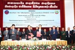 Representatives from Lao and Vietnamese agencies at the signing ceremony. (Photo: VNA)