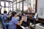 Staff at Hai Phong Railway Station assist passengers with ticket purchase procedures (Photo: VNA)