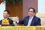 Prime Minister Pham Minh Chinh speaks at the meeting with SOEs in Hanoi on April 15. (Photo: VNA)
