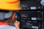 A worker from Hanoi branch of the Viettel Construction Corporation is connecting and installing 5G BTS station equipment. (Photo: VNA)