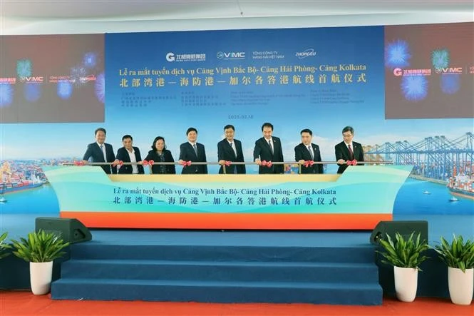 Delegates mark the launch of the new shipping route on February 18. (Photo: VNA)