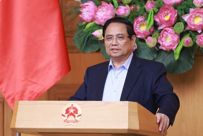 PM Pham Minh Chinh addresses the conference reviewing the one-month operation of the two-tier local government model on July 28. (Photo: VNA)