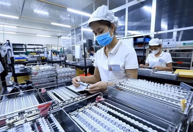 Workers at the factory of a foreign invested company. (Photo: VNA)