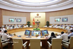 The Government’s regular meeting for March and the Government-to-locality teleconference on April 4 (Photo: VNA)