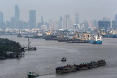 Cargo vessels move near a port in Bangkok, Thailand. (Photo: Reuters)