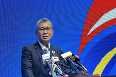 Malaysian Minister of Investment, Trade, and Industry Tengku Datuk Seri Zafrul Abdul Aziz speaks at the October 24 press conference following the 26th meeting of the ASEAN Economic Community Council (AECC) and the AECC special meeting on ASEAN Digital Economy Framework Agreement (DEFA). (Photo: VNA)