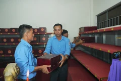 The remains are placed at the martyrs’ remains storage house at Hill 82 Martyrs’ Cemetery in Tan Bien commune, Tay Ninh province, before the re-burial ceremony. (Photo:VNA)