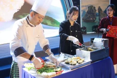 Cooks perform the making of cha muc (squid cake) at the opening ceremony of the Quang Ninh Food Festival 2024 on December 26. (Photo: baoquangninh.vn)