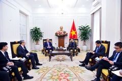 The meeting between Permanent Deputy Minister of Foreign Affairs Nguyen Minh Vu (right) and the delegation of the New Azerbaijan Party in Hanoi on January 26. (Photo: Ministry of Foreign Affair)