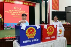 Voters cast their ballots at Polling Station No. 1 at the headquarters of Naval Flotilla 129 in Phuoc Thang ward, Ho Chi Minh City, on February 26 morning. (Photo: VNA)