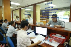 Activities at the Hanoi Department of Taxation (Photo: VNA)