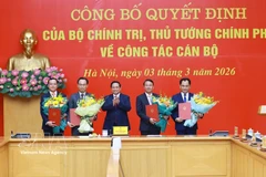 PM Pham Minh Chinh (centre) presents the decisions on personnel affairs to officials on March 3. (Photo: VNA)