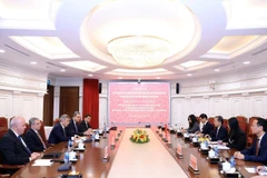 The talks between Chief Justice of the Supreme People’s Court of Vietnam Nguyen Van Quang and Chief Justice of the Supreme Court of Azerbaijan Inam Imdad Karimov in Hanoi on December 2 (Photo: VNA)