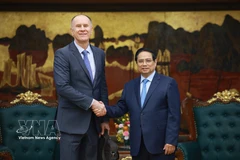 Prime Minister Pham Minh Chinh receives Martin Sommer, head of the IMF’s Article IV consultation mission team to Vietnam, in Hanoi on March 27. (Photo: VNA)