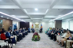 The meeting between Party General Secretary To Lam and ASEAN Secretary-General Kao Kim Hourn, along with the Committee of Permanent Representatives to ASEAN in Jakarta on March 10 (Photo: VNA)