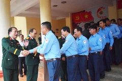 Members of Gia Lai's Team K52 bid farewell to military officials at the send-off ceremony on November 19. (Photo: VNA)