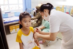 A child gets vaccinated against measles at the Centre for Disease Control in Ninh Thuan province. (Photo: VNA)