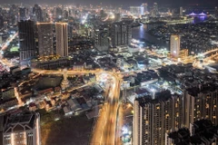 A bird’s-eye view of Phnom Penh by night shows some of the capital’s many tall building projects. (Photo: phnompenhpost.com) 