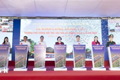 Deputy Prime Minister Pham Thi Thanh Tra (centre) and officials mark the start of work on the Ba Chuc inter-level boarding school for primary and lower secondary students in An Giang province on March 19. (Photo: VNA)