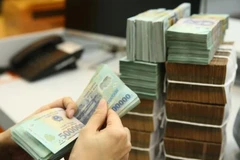 Reference exchange rate falls further on October 3 (Photo: VNA)