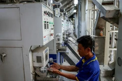 A man works at a rice mill in Nakhon Pathom province, Thailand, on April 18, 2025. (Photo: Bangkok Post) 