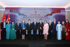 Delegates at the ceremony marking the 65th anniversary of the establishment of diplomatic relations between Vienam and Cuba, held in HCM City on December 9. (Photo: VNA)