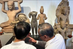 Cambodian officials look at Khmer cultural artifacts that were returned to the country, at the National Museum, Phnom Penh, Feb. 27, 2026 (Photo: AP)
