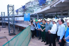 Prime Minister Pham Minh Chinh (front, fourth from right) inspects the construction site of Long Thanh International Airport on March 20. (Photo: VNA)