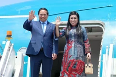 PM Pham Minh Chinh and his spouse (Photo: VNA)