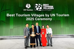 Representatives of Tuyen Quang province and organising committee pose for photo after Lô Lô Chải is honoured one of best tourism villages in 2025. — (Photos courtesy of Tuyen Quang province) 